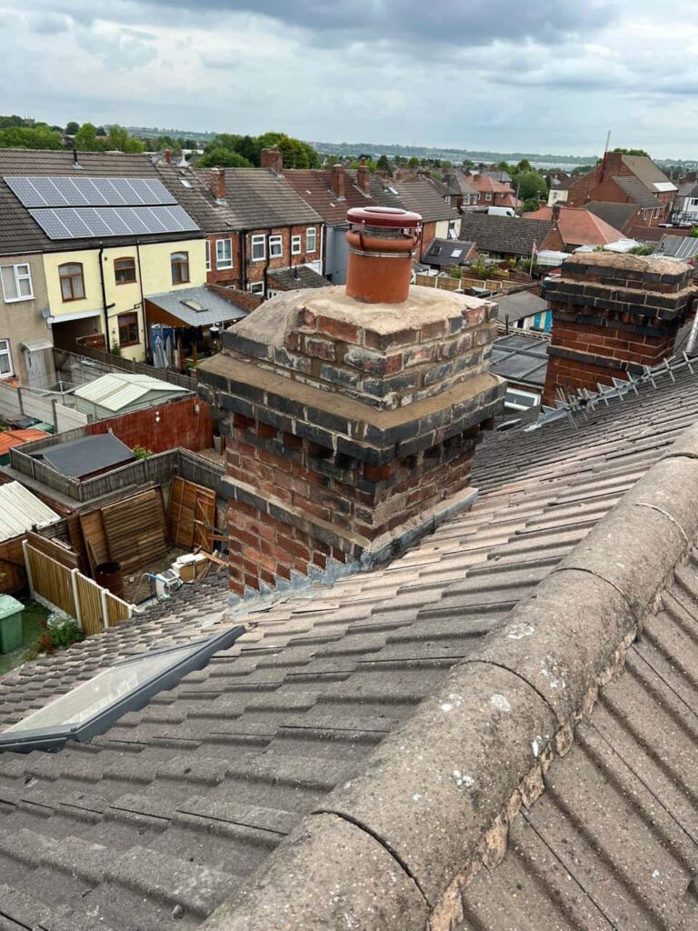 This is a photo taken from a roof which is being repaired by Ravenshead Roofing Repairs, it shows a street of houses, and their roofs